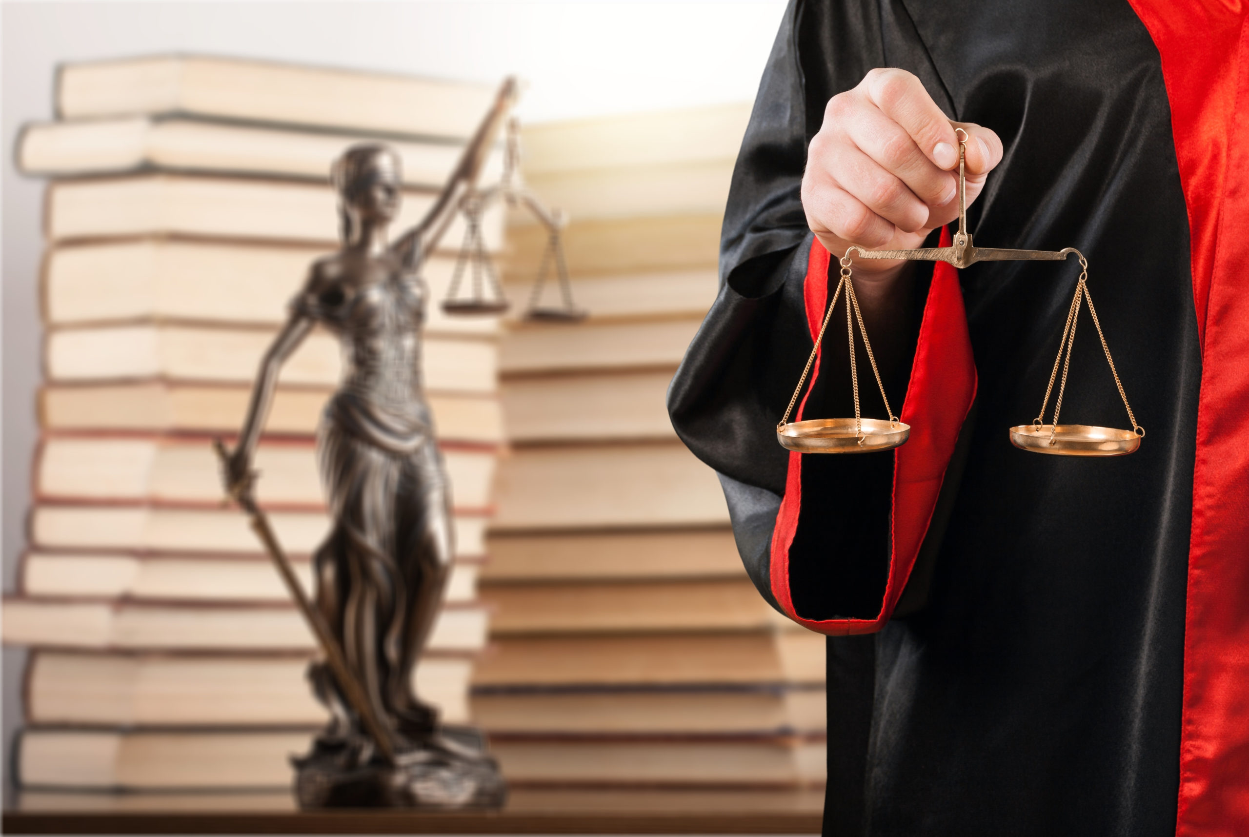 The,Judge,In,Judicial,Gown,With,Libra